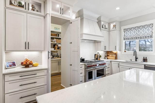 5012 Toll Road Ct, Thompsons Station, TN 37179 - kitchen featuring a sink, double oven range, custom range hood, light stone countertops, and recessed lighting