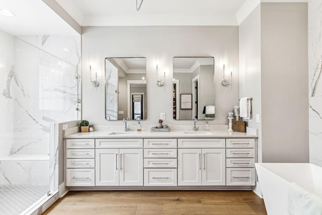 5012 Toll Road Ct, Thompsons Station, TN 37179 - full bathroom featuring crown molding, a marble finish shower, double vanity, a freestanding bath, and wood finished floors