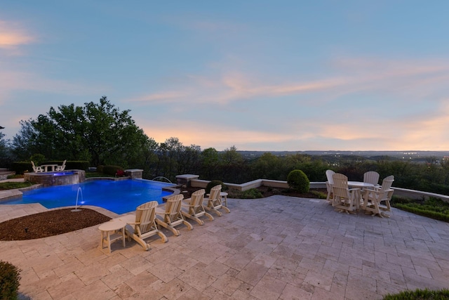 513 King Richards Ct, Franklin, TN 37067 - pool at dusk with a patio, an outdoor pool, outdoor dining space, and an in-ground hot tub