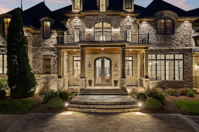 513 King Richards Ct, Franklin, TN 37067 - entrance to property with a balcony, french doors, stone siding, and a porch
