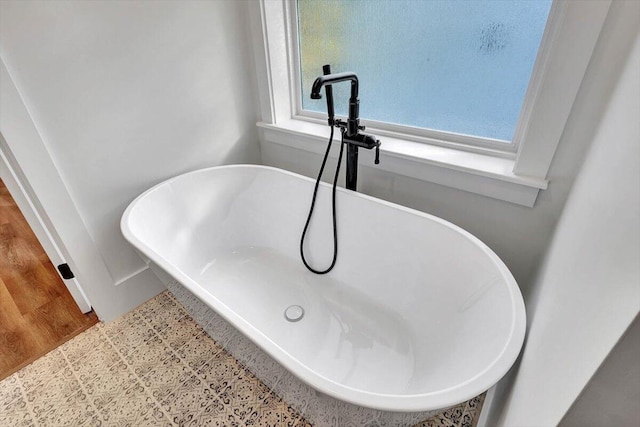 7592 Grasshopper Rd, Georgetown, TN 37336 - bathroom view of a freestanding bath, a sink, and baseboards