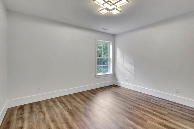 7592 Grasshopper Rd, Georgetown, TN 37336 - unfurnished room featuring wood finished floors and baseboards