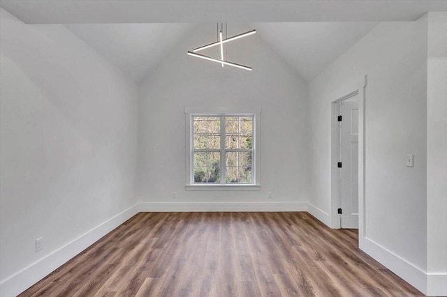 7592 Grasshopper Rd, Georgetown, TN 37336 - unfurnished dining area featuring wood finished floors, baseboards, and lofted ceiling