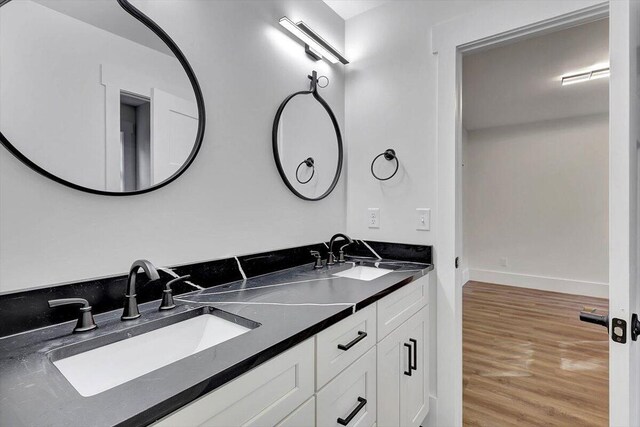 7592 Grasshopper Rd, Georgetown, TN 37336 - full bath with wood finished floors, baseboards, and double vanity
