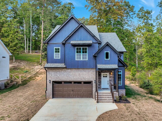 7592 Grasshopper Rd, Georgetown, TN 37336 - view of front of property featuring roof with shingles, an attached garage, brick siding, and concrete driveway