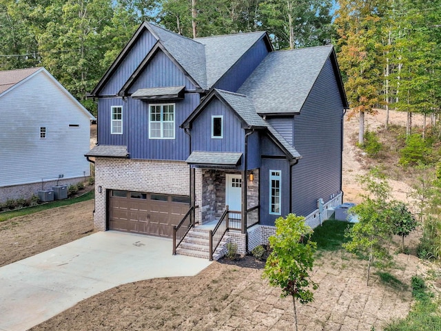 7592 Grasshopper Rd, Georgetown, TN 37336 - craftsman-style house with roof with shingles, concrete driveway, a garage, board and batten siding, and central AC unit