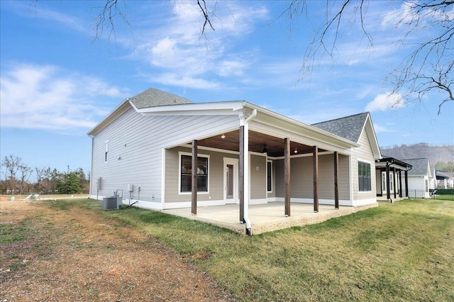 8650 Becket Way Lot # 4, Ooltewah, TN 37363 - back of property with roof with shingles, a patio area, cooling unit, and a lawn