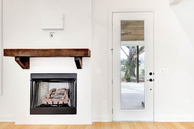8650 Becket Way Lot # 4, Ooltewah, TN 37363 - doorway featuring baseboards, a fireplace, wood finished floors, and beam ceiling