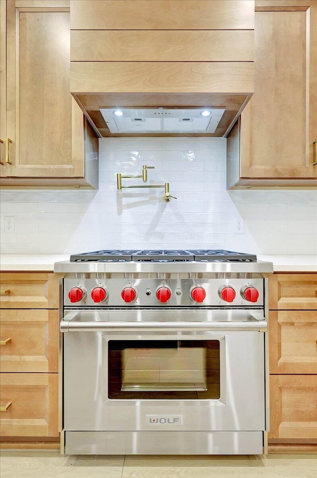 8650 Becket Way Lot # 4, Ooltewah, TN 37363 - kitchen featuring luxury range, decorative backsplash, light countertops, and light brown cabinetry