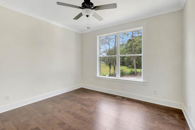 7383 Gamble Rd Lot # 5, Georgetown, TN 37336 - spare room with ornamental molding, baseboards, a ceiling fan, and dark wood-style flooring