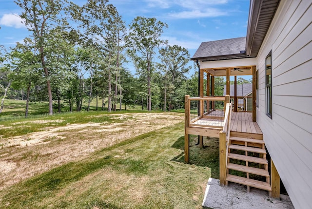 7383 Gamble Rd Lot # 5, Georgetown, TN 37336 - view of grassy yard featuring stairway, a deck, view of wooded area, and a ceiling fan