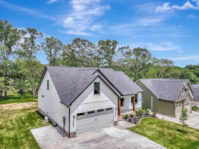 7383 Gamble Rd Lot # 5, Georgetown, TN 37336 - modern farmhouse featuring board and batten siding, driveway, roof with shingles, and a front yard