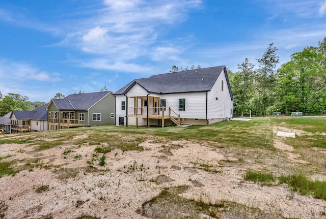 7383 Gamble Rd Lot # 5, Georgetown, TN 37336 - back of house featuring a wooden deck, a yard, and a shingled roof