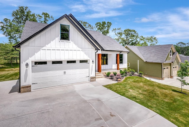 7383 Gamble Rd Lot # 5, Georgetown, TN 37336 - modern farmhouse style home featuring board and batten siding, a shingled roof, a front yard, concrete driveway, and an attached garage