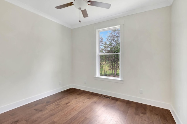 7387 Gamble Rd Lot # 4, Georgetown, TN 37336 - empty room featuring baseboards, dark wood-style floors, ceiling fan, and ornamental molding