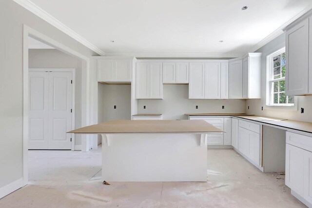 7452 Peytons Rise Way Lot # 52, Georgetown, TN 37336 - kitchen with a kitchen island, ornamental molding, and white cabinets