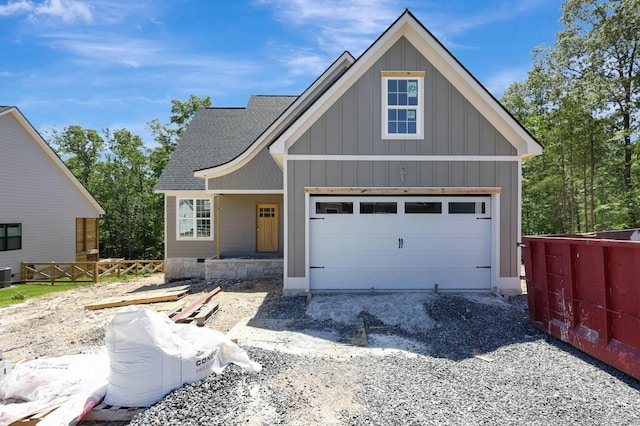 7452 Peytons Rise Way Lot # 52, Georgetown, TN 37336 - view of front facade with board and batten siding, a shingled roof, and central AC unit