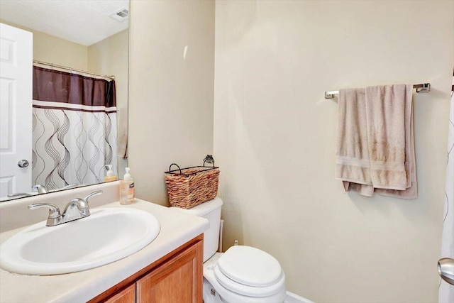 39 Middlebrook Dr, Cartersville, GA 30120 - bathroom featuring toilet, vanity, and curtained shower