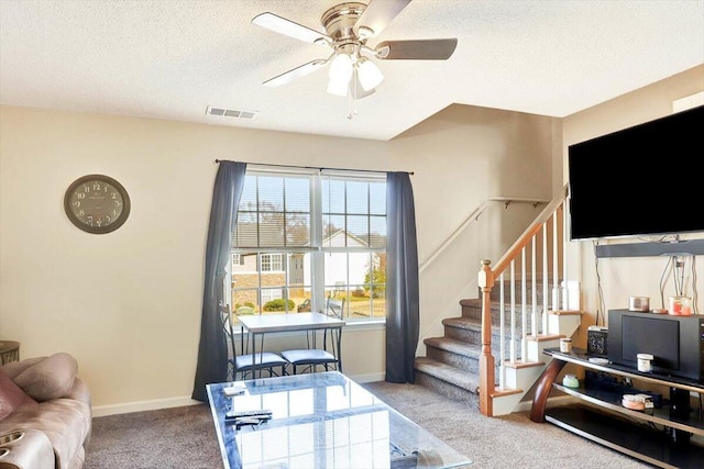 39 Middlebrook Dr, Cartersville, GA 30120 - living room with carpet, stairway, a ceiling fan, a textured ceiling, and baseboards