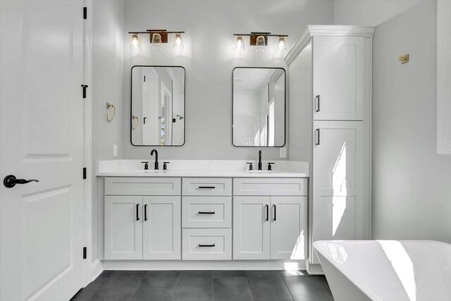 8656 Becket Way Lot # 5, Ooltewah, TN 37363 - bathroom with a freestanding tub, double vanity, and tile patterned flooring