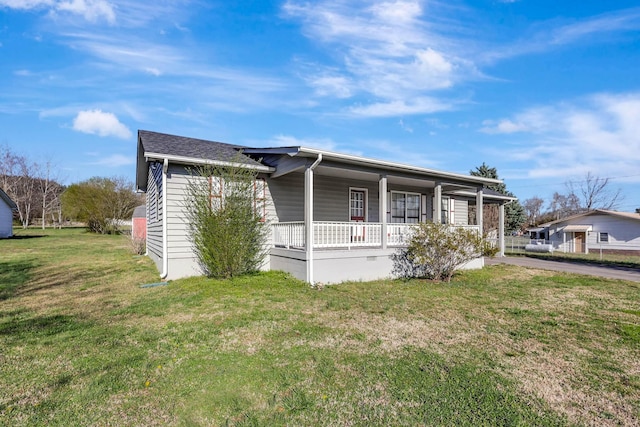 view of front of property with a porch and a front lawn