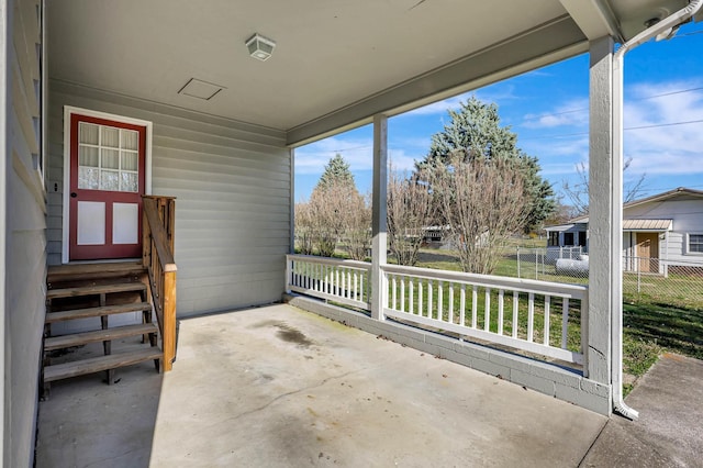 view of patio featuring fence