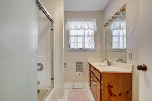 bathroom with tile patterned flooring, vanity, shower / washtub combination, and baseboards