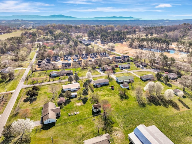 aerial view of residential area featuring a mountainous background