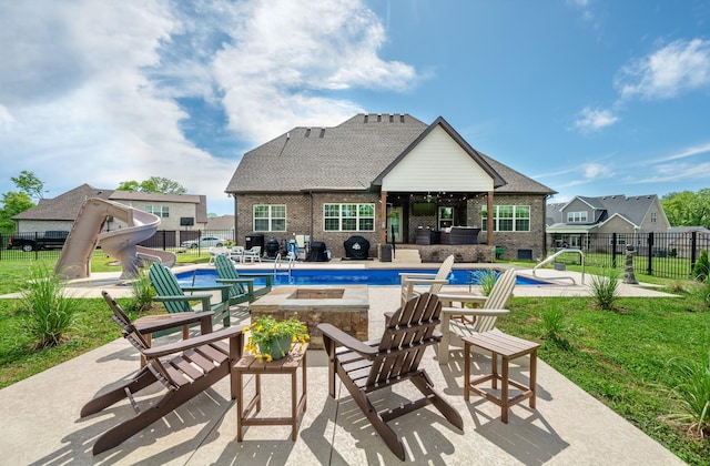 105 Bowwater Pl, Gallatin, TN 37066 - view of pool with a water slide, a patio area, a fire pit, and a hot tub