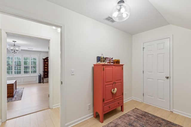 3348 Berryside Dr, Murfreesboro, TN 37128 - hall featuring light wood-type flooring, a chandelier, vaulted ceiling, and baseboards