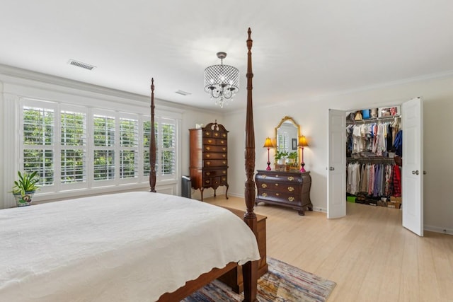 3348 Berryside Dr, Murfreesboro, TN 37128 - bedroom featuring multiple windows, light wood finished floors, a chandelier, crown molding, and baseboards
