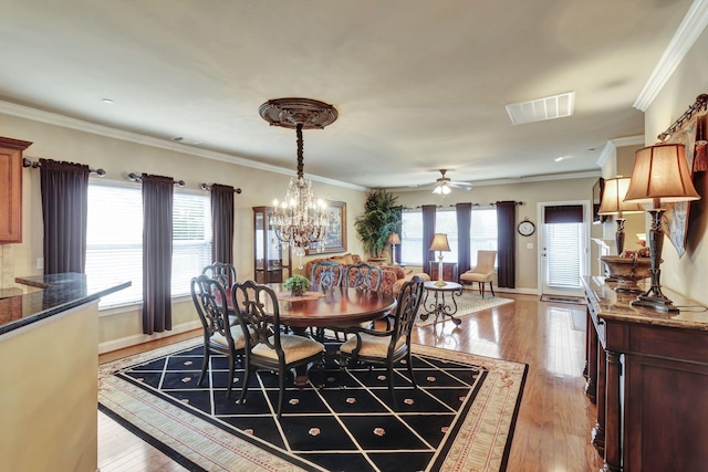 3157 Locust Holw, Nolensville, TN 37135 - dining area with healthy amount of natural light, light wood-type flooring, a ceiling fan, and crown molding