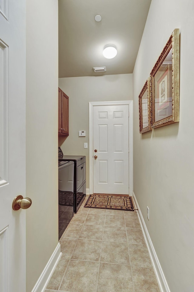 3157 Locust Holw, Nolensville, TN 37135 - doorway featuring washing machine and dryer, baseboards, and light tile patterned floors