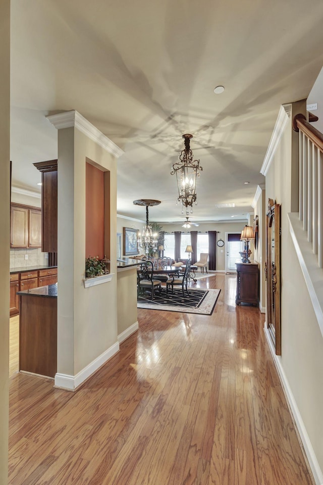 3157 Locust Holw, Nolensville, TN 37135 - hall featuring a chandelier, crown molding, wood finished floors, stairs, and baseboards