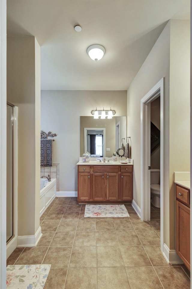 3157 Locust Holw, Nolensville, TN 37135 - bathroom featuring vanity, tile patterned floors, a garden tub, and a stall shower