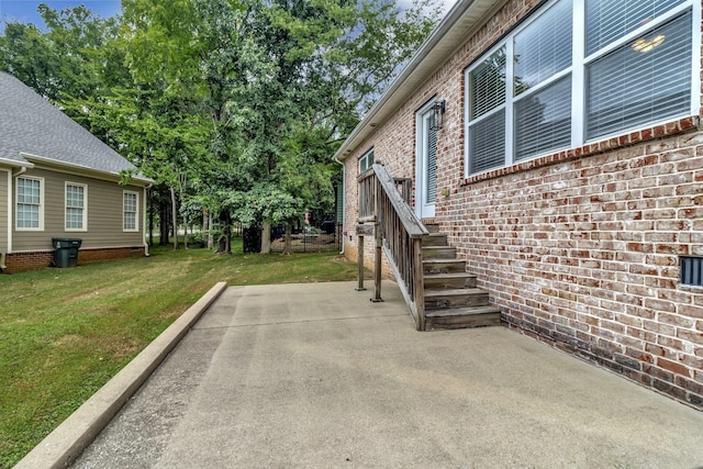 3157 Locust Holw, Nolensville, TN 37135 - view of home's exterior with a lawn, a patio area, and brick siding