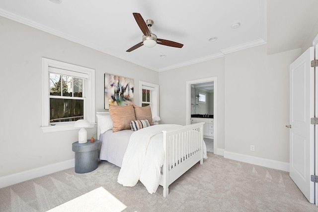 bedroom featuring light carpet, crown molding, baseboards, and connected bathroom