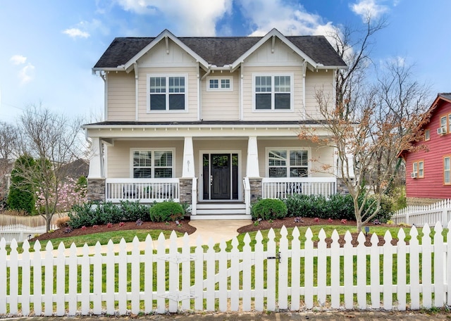 craftsman house featuring covered porch, board and batten siding, roof with shingles, and stone siding