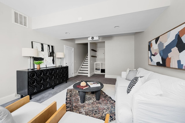 carpeted living room with baseboards, stairway, and recessed lighting