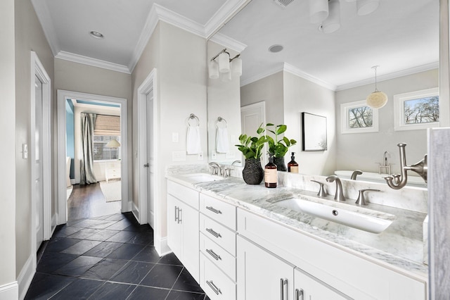 bathroom with baseboards, stone tile floors, double vanity, crown molding, and recessed lighting