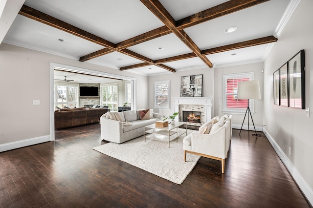 living room featuring a fireplace, baseboards, plenty of natural light, beam ceiling, and dark wood-type flooring