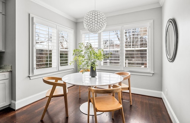 dining area featuring plenty of natural light, baseboards, dark wood-style floors, and crown molding