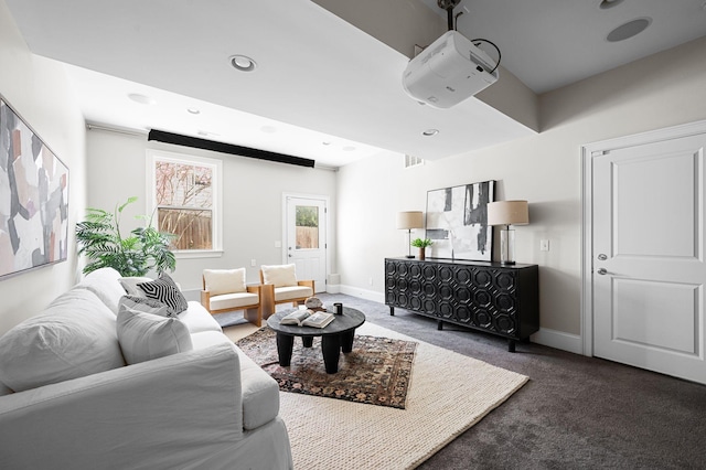 living area featuring carpet, baseboards, and recessed lighting
