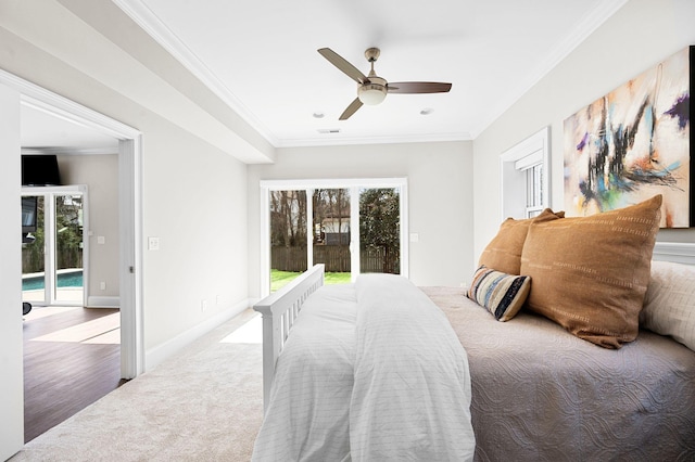 carpeted bedroom with access to exterior, ornamental molding, baseboards, and ceiling fan