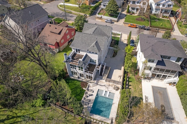 aerial view of residential area featuring a pool area