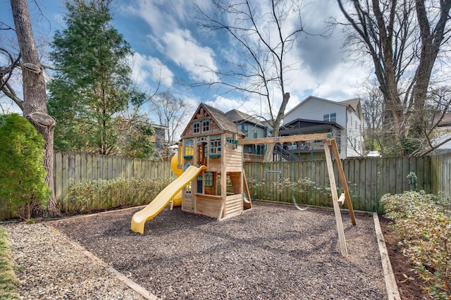 view of jungle gym featuring fence