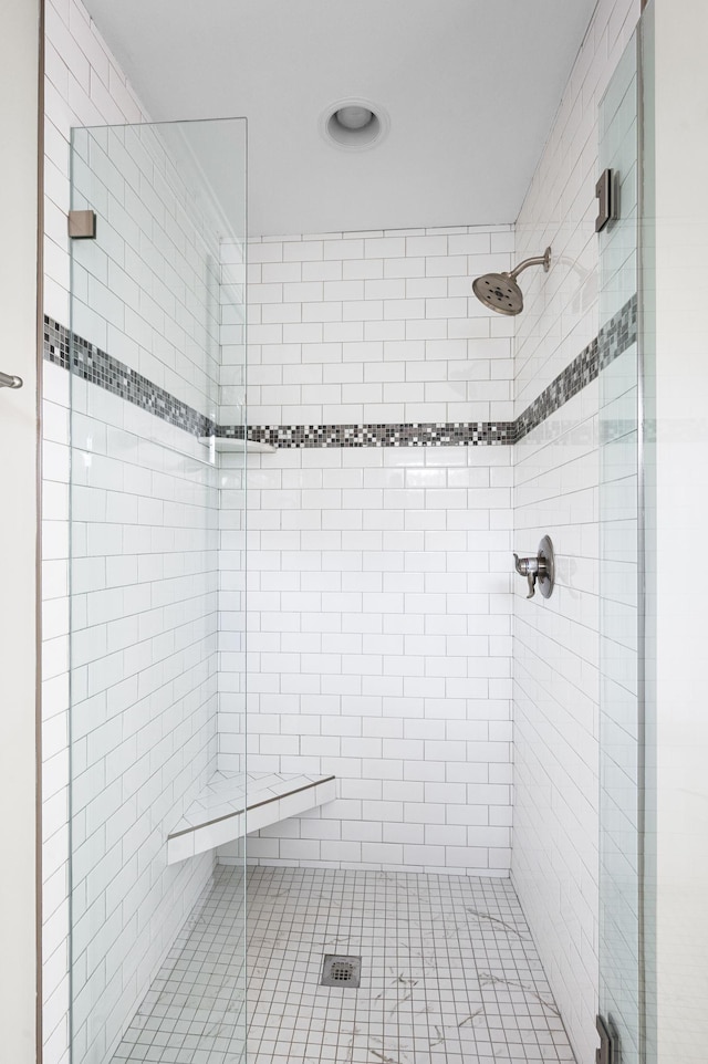 bathroom featuring a stall shower and recessed lighting