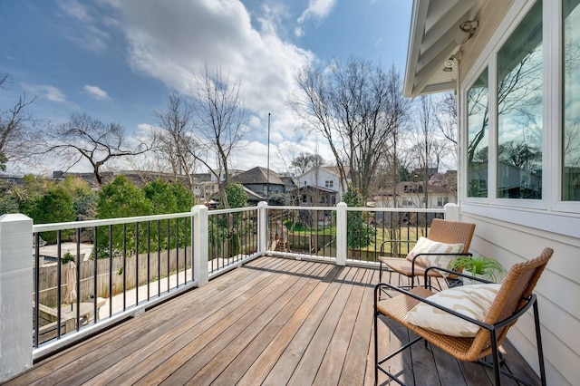 wooden deck with a residential view