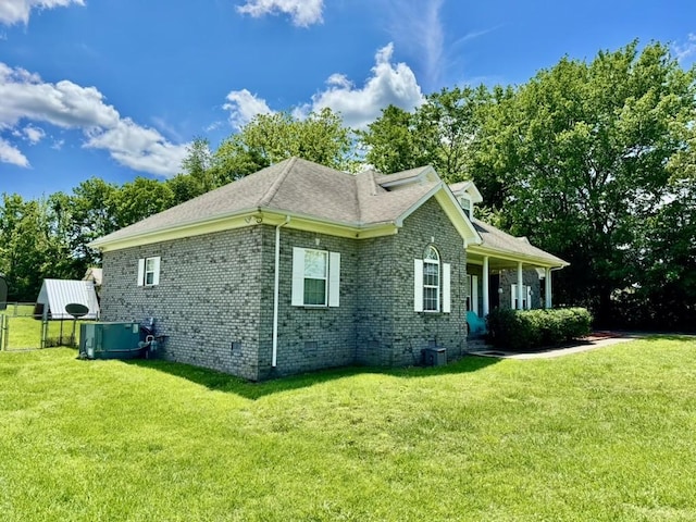 435 Long St W, Mc Ewen, TN 37101 - view of side of property featuring brick siding, cooling unit, and roof with shingles