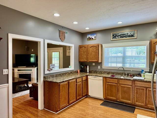 435 Long St W, Mc Ewen, TN 37101 - kitchen featuring a sink, dishwasher, brown cabinetry, light wood finished floors, and recessed lighting